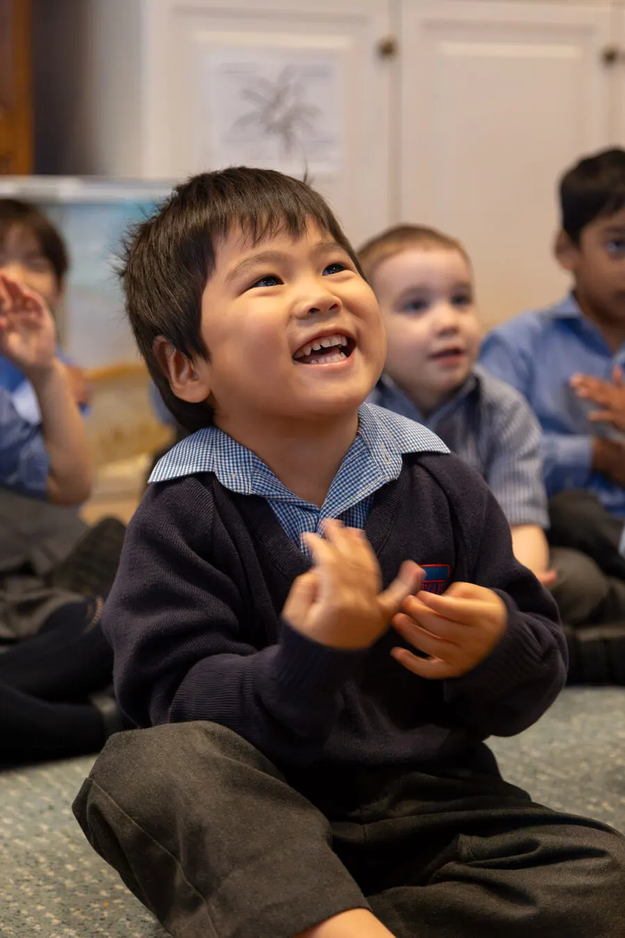 Young children exploring and playing together in a bright Early Years classroom at BJAB Brussels