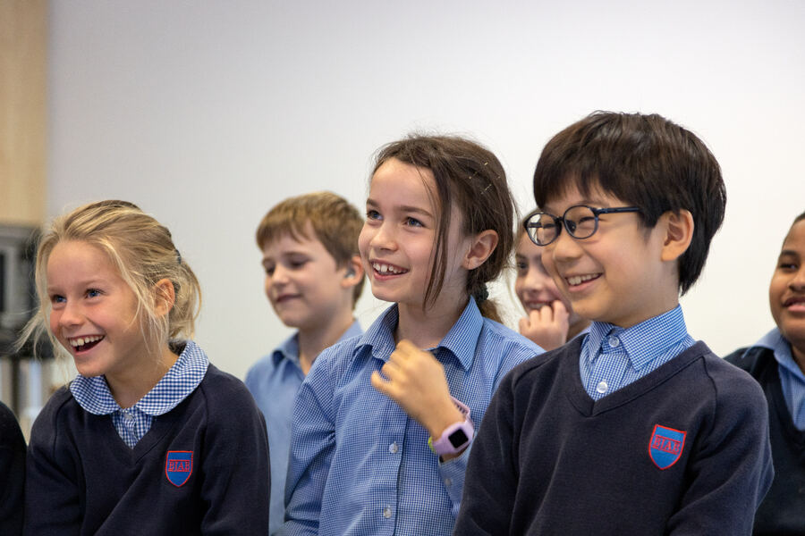 Pre-Prep pupils in a focused lesson at BJAB Brussels, developing phonics and early numeracy skills