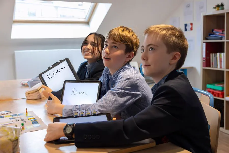 Prep pupils collaborating in a vibrant classroom at BJAB Brussels, engaged in the British primary curriculum