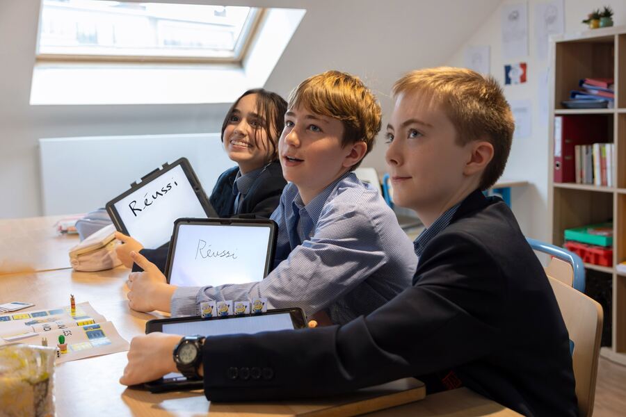 Prep pupils collaborating in a vibrant classroom at BJAB Brussels, engaged in the British primary curriculum